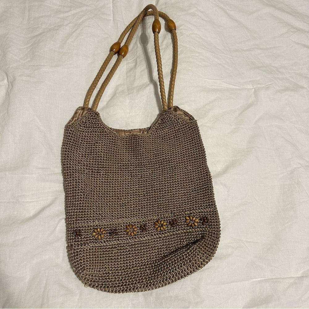 Boho style woven shoulder bag with flower detail
